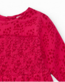 Blusa para niña color fucsia con detalle de nido de abeja.