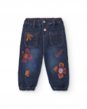 Pantalón vaquero para niña en azul con estampado floral Pantalón vaquero para niña en azul con estampado floral