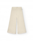 Pantalón acampanado niña en color beige con textura trenzada Pantalón acampanado niña en color beige con textura trenzada