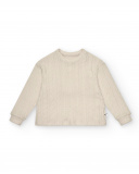 Jersey niña en color beige con textura trenzada colección The Jersey niña en color beige con textura trenzada colección The