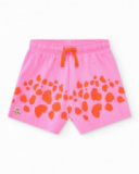 Short rosa para niña con estampado de manchas naranjas y Short rosa para niña con estampado de manchas naranjas y
