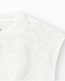 Camiseta para niña en blanco con lentejuelas y bajo elástico Camiseta para niña en blanco con lentejuelas y bajo elástico