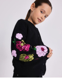 Chaqueta negra para niña con flores de lentejuelas en las mangas | tuc tuc Chaqueta negra para niña con flores de lentejuelas en las mangas | tuc tuc