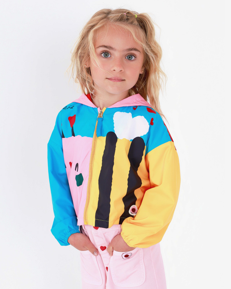 Coupe-vent multicolore avec un imprimé amusant et une capuche Happy Garden