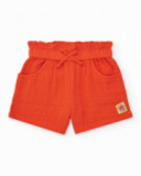 Short orange pour fille avec nœud et poches latérales