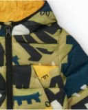 Veste matelassée verte pour garçon avec imprimé de dinosaures et doublure jaune Veste matelassée verte pour garçon avec imprimé de dinosaures et doublure jaune