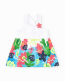 Robe blanche pour fille avec bretelles croisées et jupe fleurie