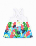 Robe blanche pour fille avec bretelles croisées et jupe fleurie