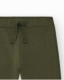 Pantalon pour garçon en vert avec taille élastique et cordon de serrage.