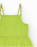 Mono para niña en verde con tirantes y detalles multicolor