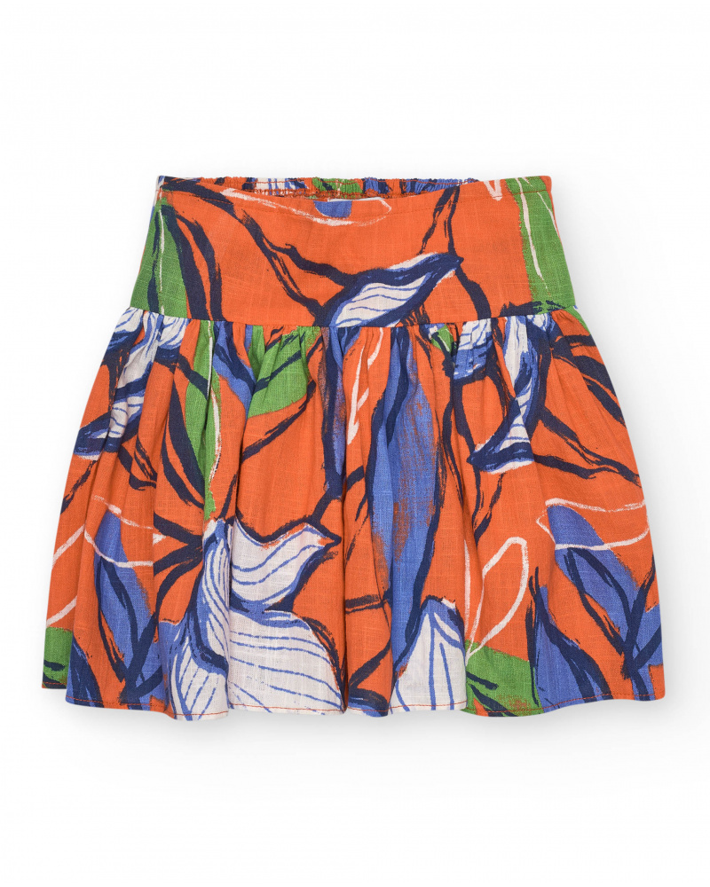 Jupe pour fille en orange avec taille élastique et imprimé floral.