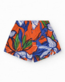 Short pour fille en orange avec taille élastique et imprimé floral.