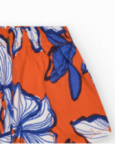 Short pour fille en orange avec taille élastique et imprimé floral.