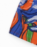 Short pour fille en orange avec taille élastique et imprimé floral.