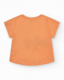 T-shirt à manches courtes pour fille en orange avec imprimé frontal.