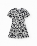 Robe pour fille en blanc et noir avec manches bouffantes et imprimé floral.