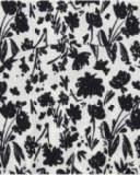 Robe pour fille en blanc et noir avec manches bouffantes et imprimé floral.