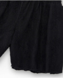 Short pour fille en noir avec taille élastique et imprimé floral.