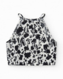 Top pour fille en blanc avec bretelles et imprimé floral.