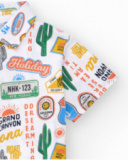 Polo pour garçon en blanc avec imprimé sur un voyage dans le désert.