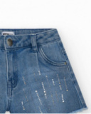 Short pour fille en bleu avec détails brillants et ourlet effiloché