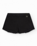 Jupe-short pour fille en noir avec détails métalliques.