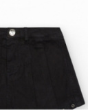 Jupe-short pour fille en noir avec détails métalliques.