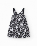 Robe pour fille en noir avec bretelles ajustables et appliques.