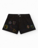 Short pour fille en noir décoré avec des clous colorés.