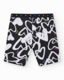 Legging cycliste pour fille en noir avec cœurs imprimés et taille décorée de clous.