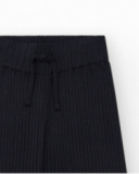 Pantalon pour fille en noir avec taille élastique et cordon de serrage.