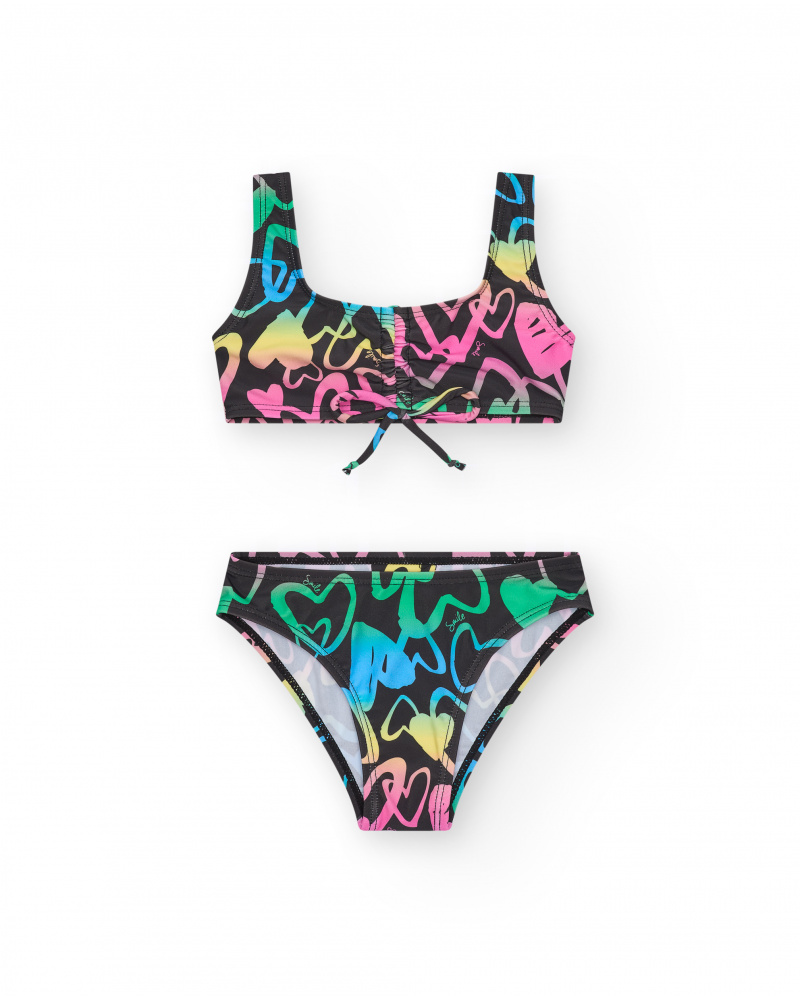 Bikini pour fille en noir avec cœurs imprimés et nœud décoratif.