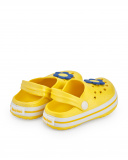 Zuecos para niña en amarillo con flor decorativa