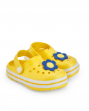 Zuecos para niña en amarillo con flor decorativa