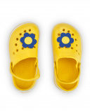 Zuecos para niña en amarillo con flor decorativa