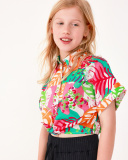 Chemise pour fille avec imprimé tropical et nœud à l’avant.