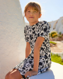 Robe pour fille en blanc et noir avec manches bouffantes et imprimé floral. | tuc tuc