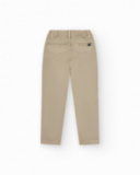 Pantalon beige pour garçon avec poches latérales et taille ajustable.
