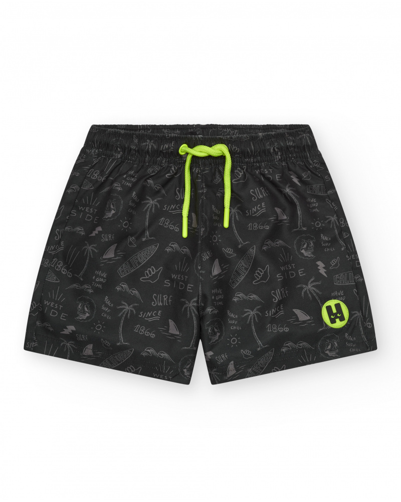 Short de bain noir pour garçon avec imprimé surfeur et cordon fluo.