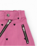 Mini-jupe fille en rose avec cœurs et fermeture zippée diagonale