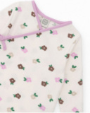 Ensemble t-shirt et pantalon à pieds pour nouveau-né dans les tons crème et lilas avec imprimé