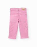 Pantalon long en sergé stretch pour fille couleur rose avec imprimé de petites étoiles dorées.