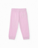 Pyjama en tricot pour fille couleur rose avec imprimé de macarons. Pyjama en tricot pour fille couleur rose avec imprimé de macarons.
