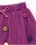 Jupe en tulle pour fille couleur fuchsia avec appliqués de boutons multicolores.