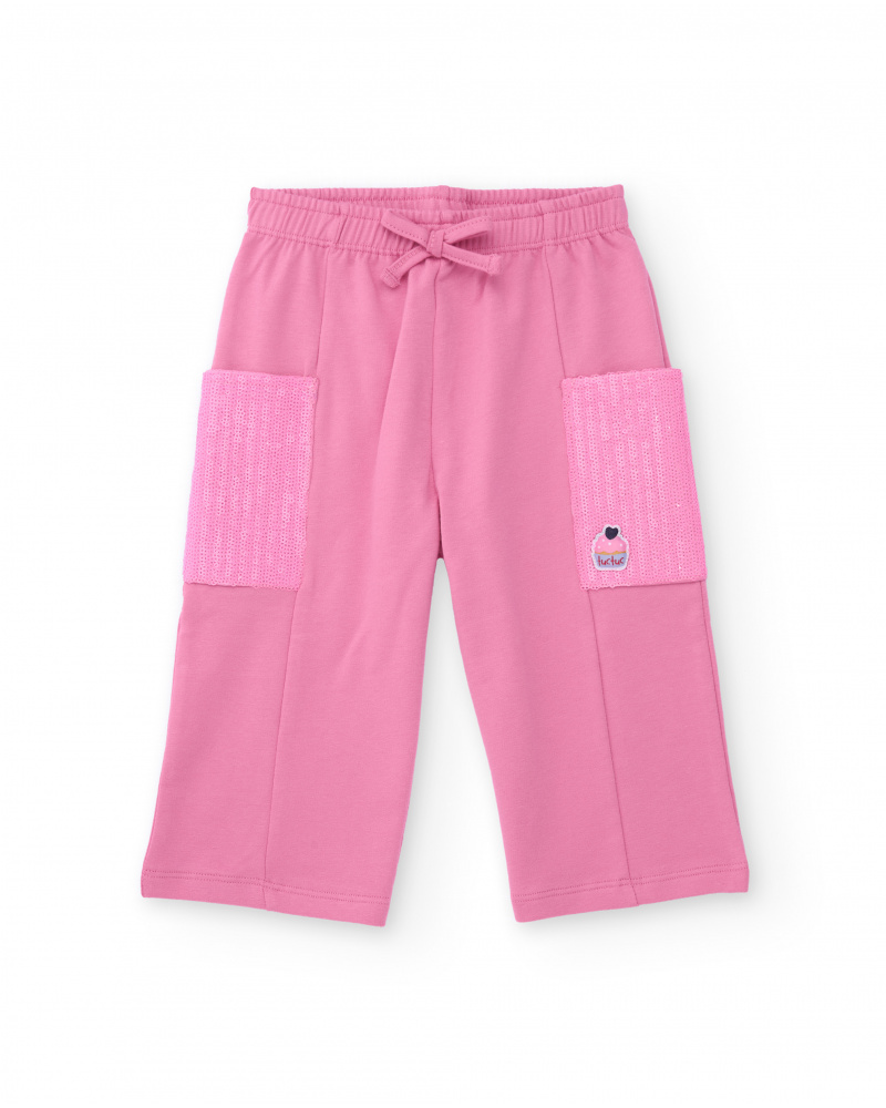 Pantalon rose pour fille avec poches latérales à sequins et taille ajustable.