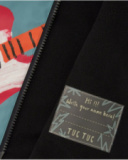 Imperméable pour garçon avec motif guitare et capuche monstre.