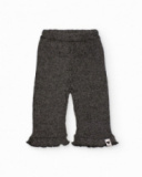 Pantalon en maille pour fille en gris avec volant en bas.