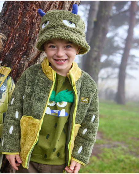 Veste en peluche pour fille en tons vert et jaune avec fermeture éclair frontale.