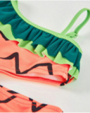 Maillot de bain fille en maille avec volant asymétrique