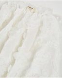 Jupe fille en tissu tissé avec fleurs en relief